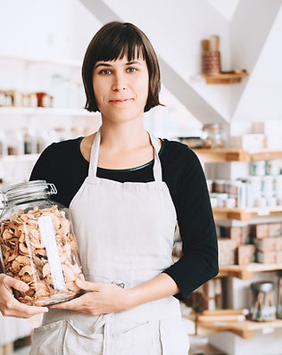 Store Employee Holding Jar