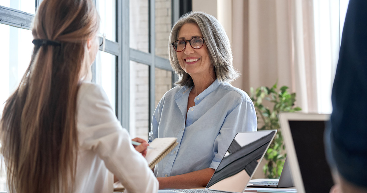 An employee meeting with their manager to discuss a graduated return-to-work plan and workplace adjustments.