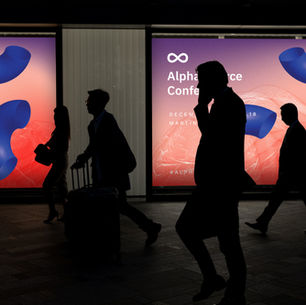 People walking next to marketing commercials