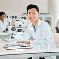 Scientist at microscope
