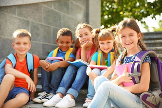 Children smiling with supplies