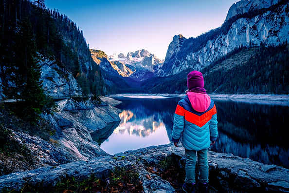 Child at mountain lake