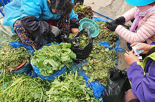 Street Vendor Selling Vegetables