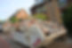 Overfilled dumpster with bricks and debris
