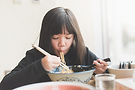 Girl Eating Noodles