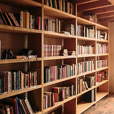 A wall of book shelves full of books