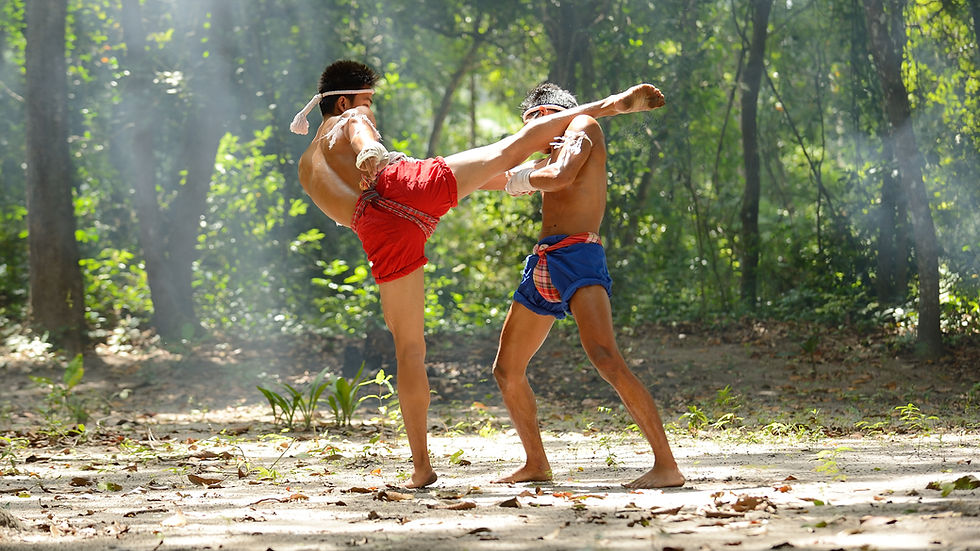 Close-up view of a Muay Thai trainer demonstrating elbow strike technique to a student