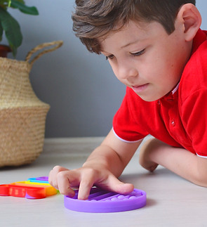 Child with Fidget Toy