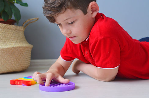 Child with Fidget Toy