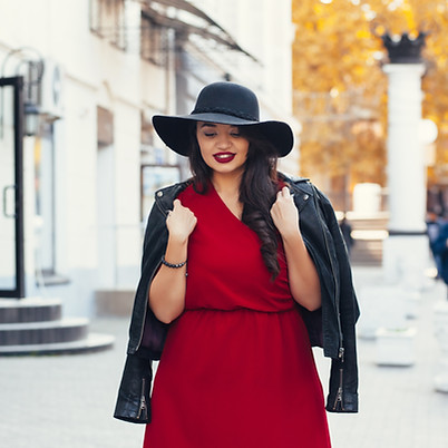 Young woman in a red dress and hat
