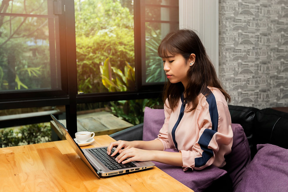 A woman using a laptop.