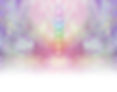 Symmetrical pastel colored wispy misty background with vertical row of seven chakras place