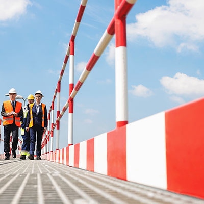 Workers Wearing Helmets and Jackets