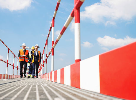 Workers Wearing Helmets and Jackets