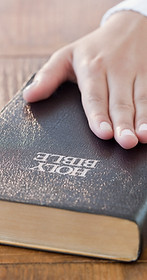 Hand on Bible