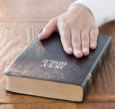 Hand on Bible