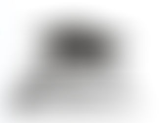 A stack of books with a graduation cap on top