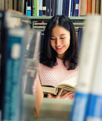 College Student Enjoying a Book