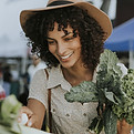 Woman Buying Kale