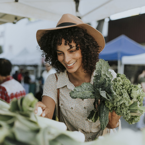 Woman Buying Kale