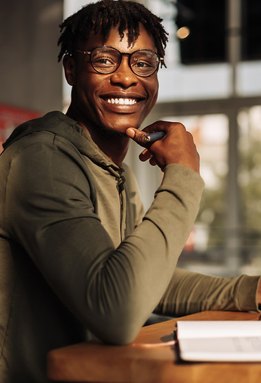 Smiling post-secondary student in a library