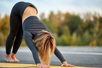 Stretching on a Mat Outdoors