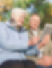 Elderly couple reading a Sage &