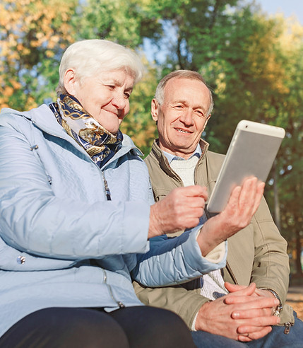 Elderly Couple Researching On Tablet
