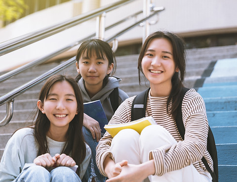 Smiling Students Sitting Together