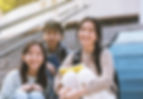 Smiling Students Sitting Together
