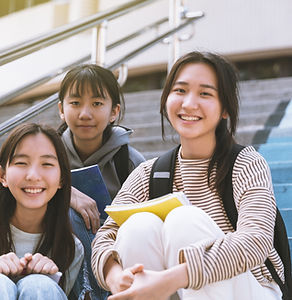 Smiling Students Sitting Together