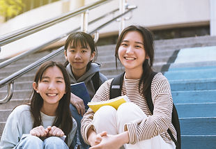 Smiling Students Sitting Together