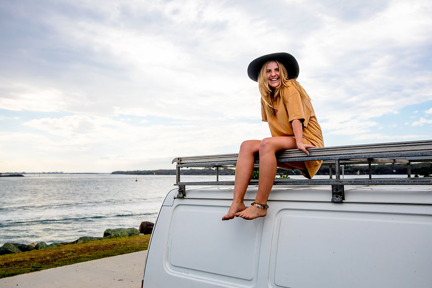 Woman on Van by Beach