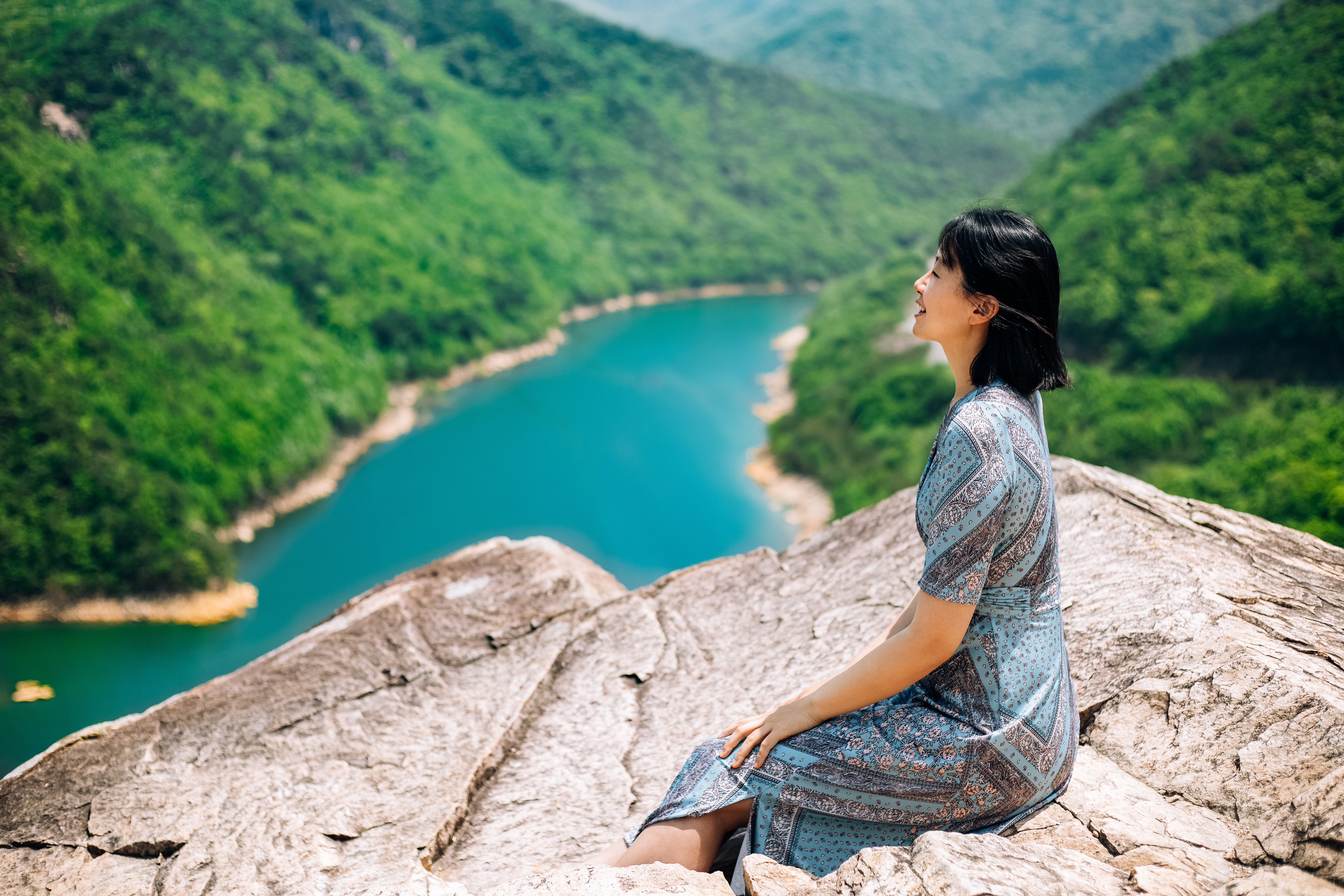 Person Sitting On Rock