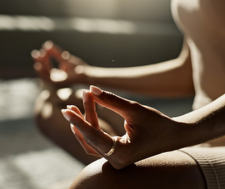 Woman Meditating Indoors