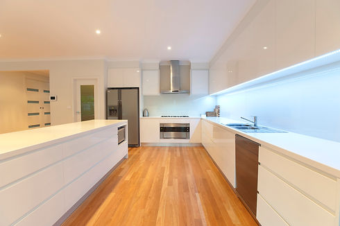 Kitchen with wooden flooring and newly coated walls