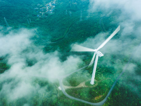 Wind turbine powering a renewable data centre—symbolising the convergence of clean energy and digital infrastructure