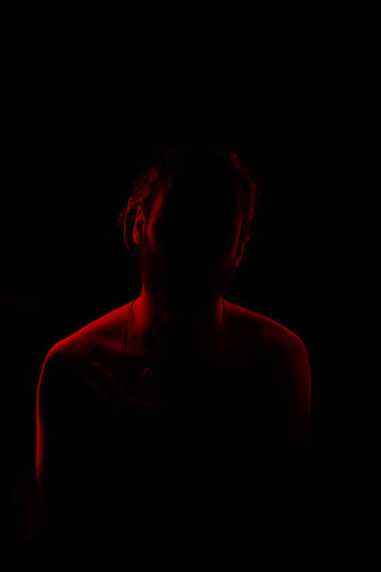 Black with red outline of a man