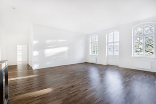 Clean empty white room with large windows after property clearance