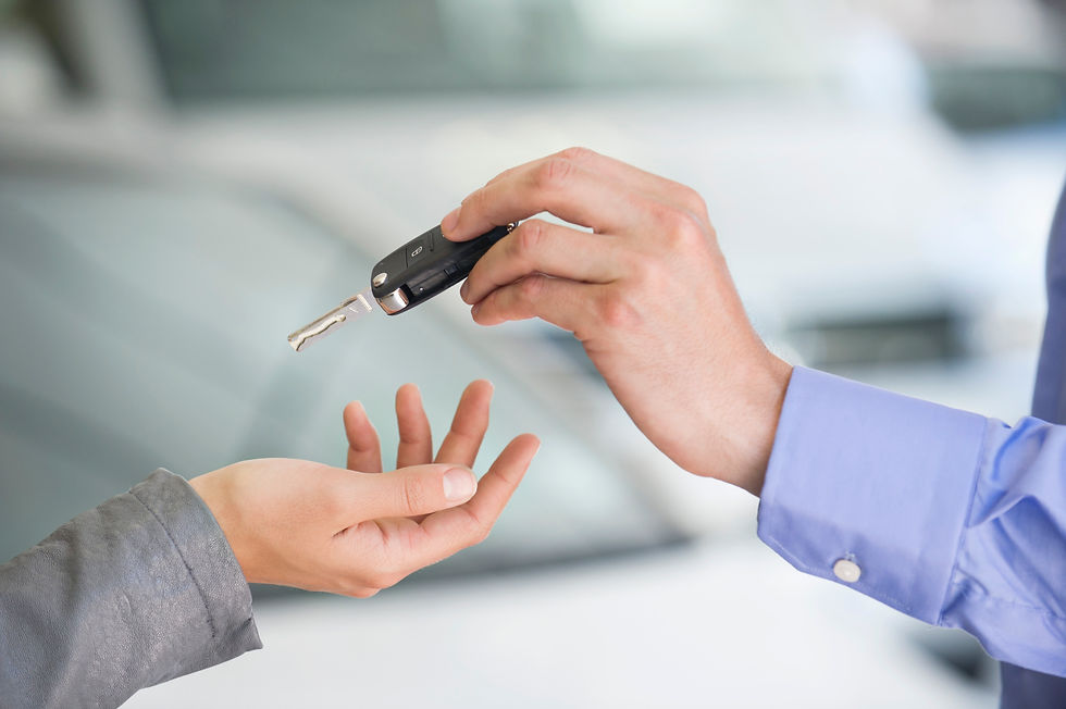 keys being given to a new car owner