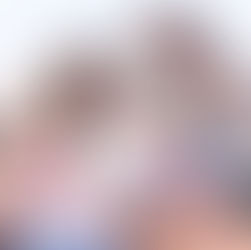 A joyful family video call, relaxing on the couch, sharing laughs and waves with loved ones on the laptop.