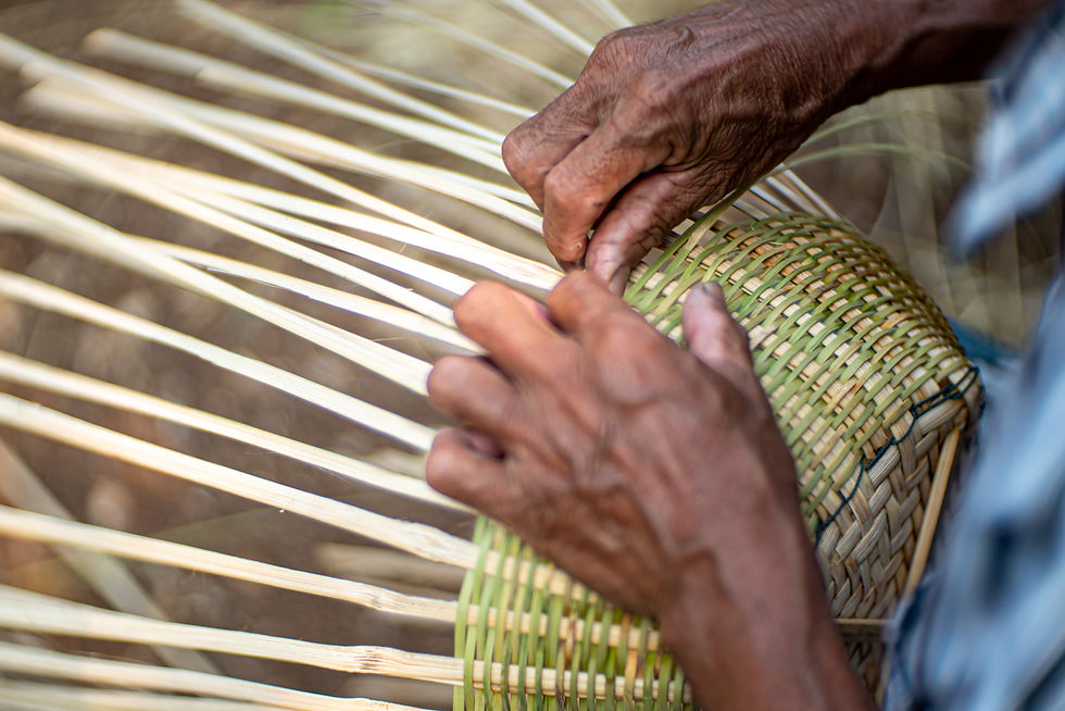 An old person weaving basket