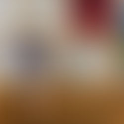 five-year-old boy sitting on a wooden shelf, reading a picture book and tracing words with his finger—cozy home reading nook