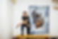 Person standing by a painting