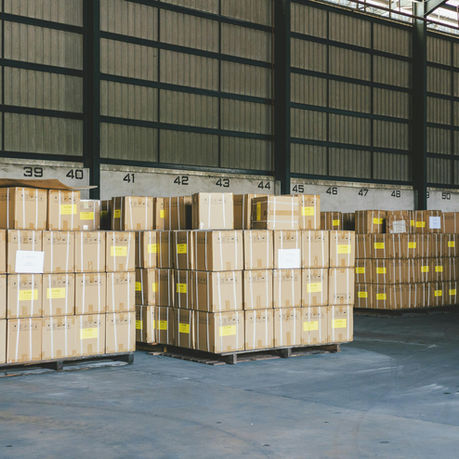 Stacked shipping boxes prepared for warehouse distribution and customer delivery.