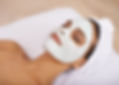 Shot of a young woman enjoying a facial treatment at a spa