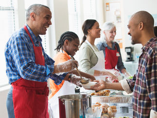 group of volunteers standing around a table