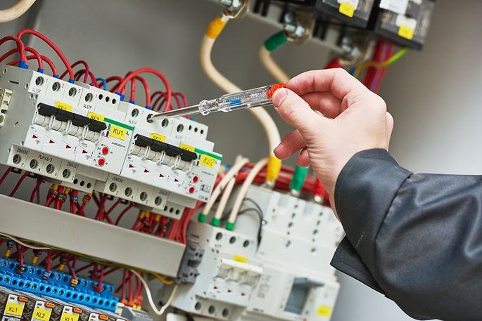 Hand testing consumer unit switches with a voltage tester screwdriver for prompt electrical services in Horsham