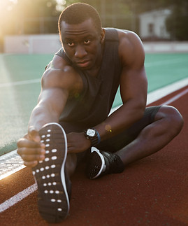 Athlete Stretching Legs