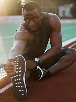 Athlete Stretching Legs